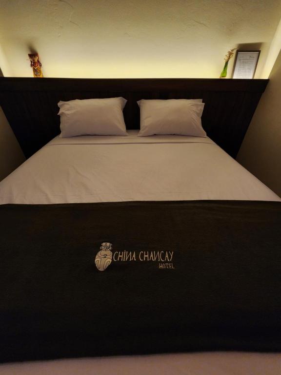 Postel nebo postele na pokoji v ubytování China Chancay Hotel