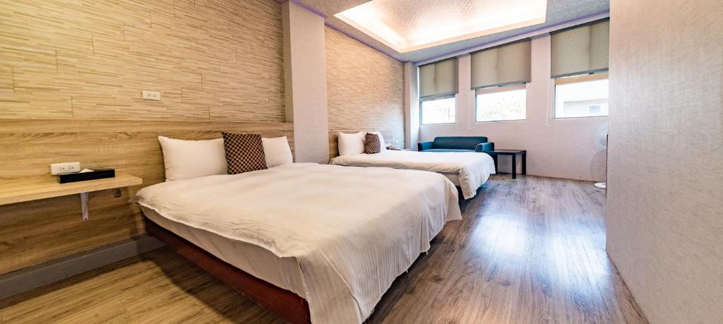 Postel nebo postele na pokoji v ubytování Beauty Garden Hotel - Jiaoxi