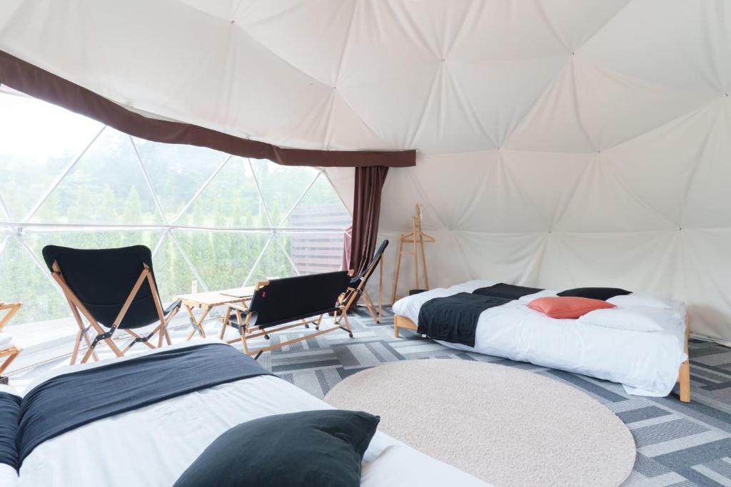 Postel nebo postele na pokoji v ubytování Glamping Resort Varie