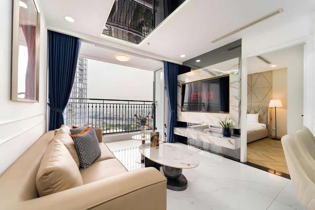 a living room with a couch and a table at Luminous Landmark Apartment in Ho Chi Minh City
