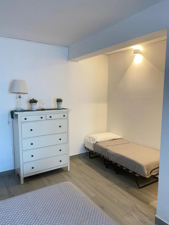 Postel nebo postele na pokoji v ubytování Monolocale moderno