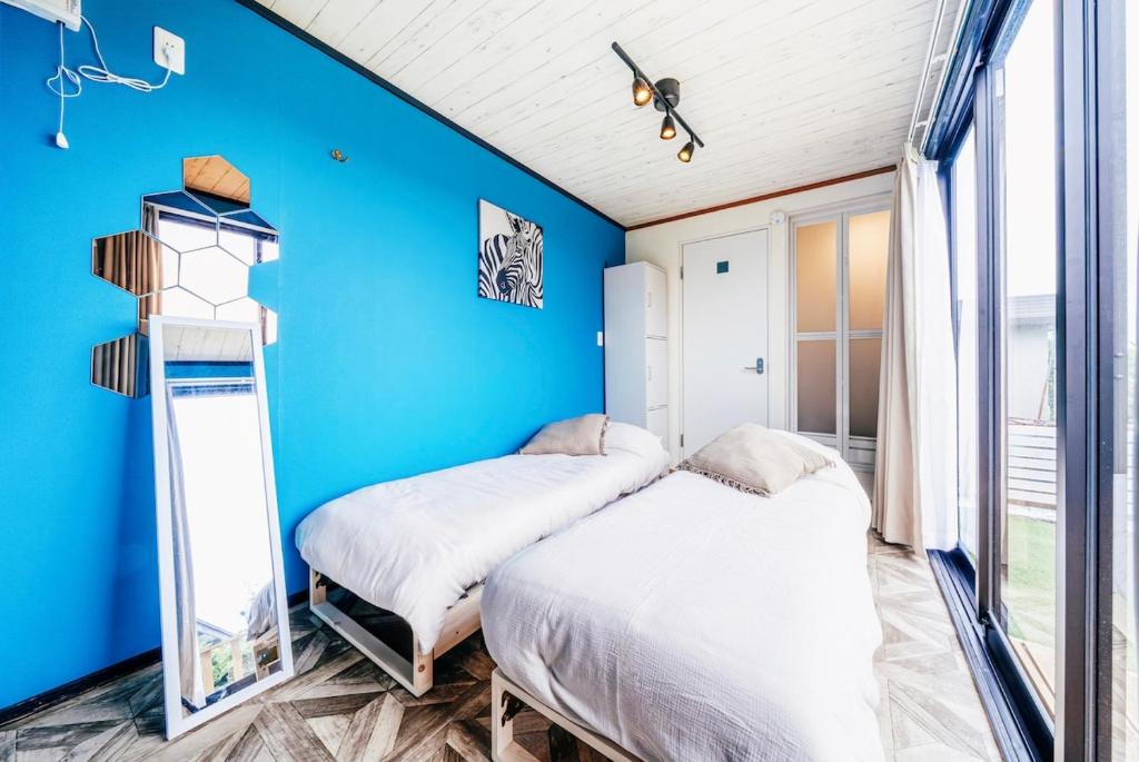 Postel nebo postele na pokoji v ubytování T-Base 02