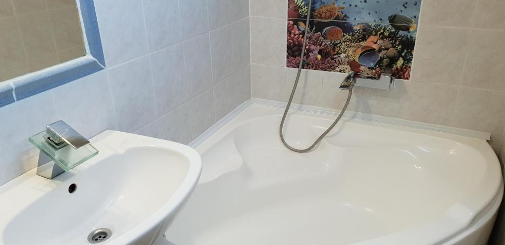 Łazienka w obiekcie Liget Nyaralóház és Apartman Liget