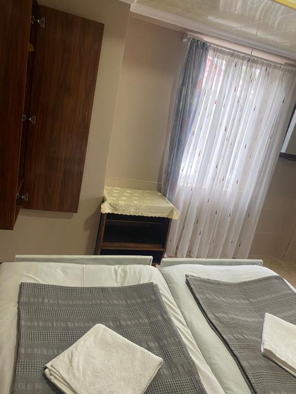 Postel nebo postele na pokoji v ubytování Vakho house