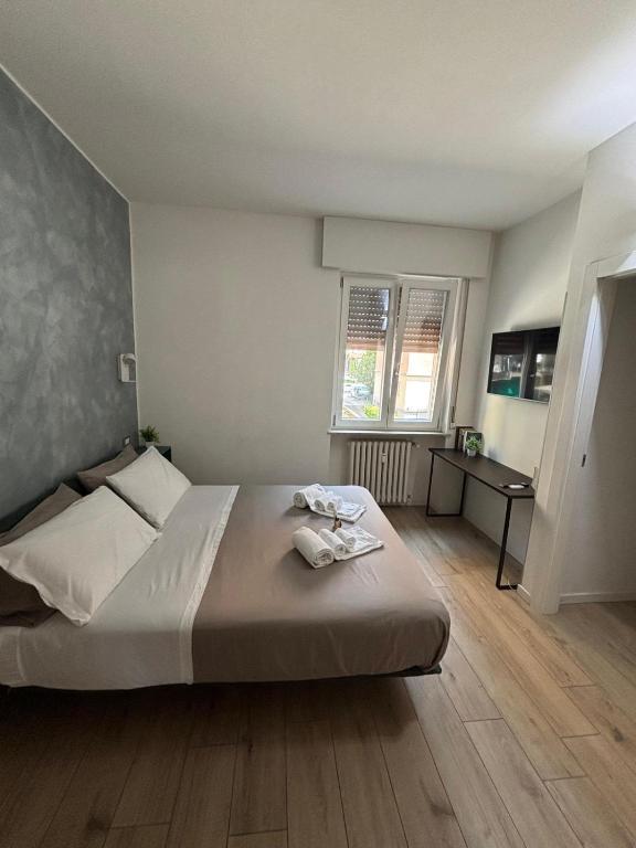 Posteľ alebo postele v izbe v ubytovaní san rocco apartments