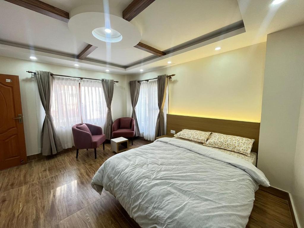 Una cama o camas en una habitación de Patan Stay by SAMS