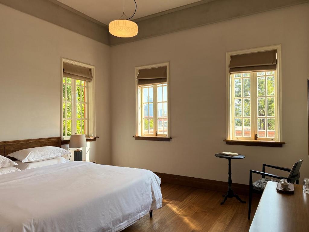 Postel nebo postele na pokoji v ubytování Xiamen Gulangyu Bishan Residence