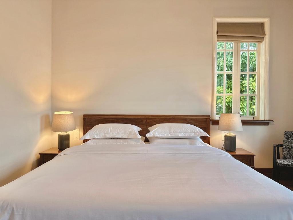 Postel nebo postele na pokoji v ubytování Xiamen Gulangyu Bishan Residence