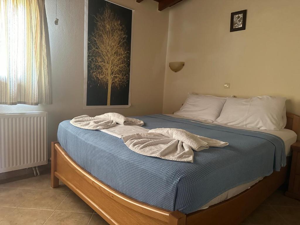 Postel nebo postele na pokoji v ubytování Mpalmpanas Villas