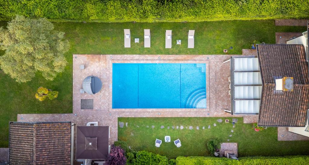 an overhead view of a swimming pool in a yard at Villa Gatti Marina di Pietrasanta in Marina di Pietrasanta
