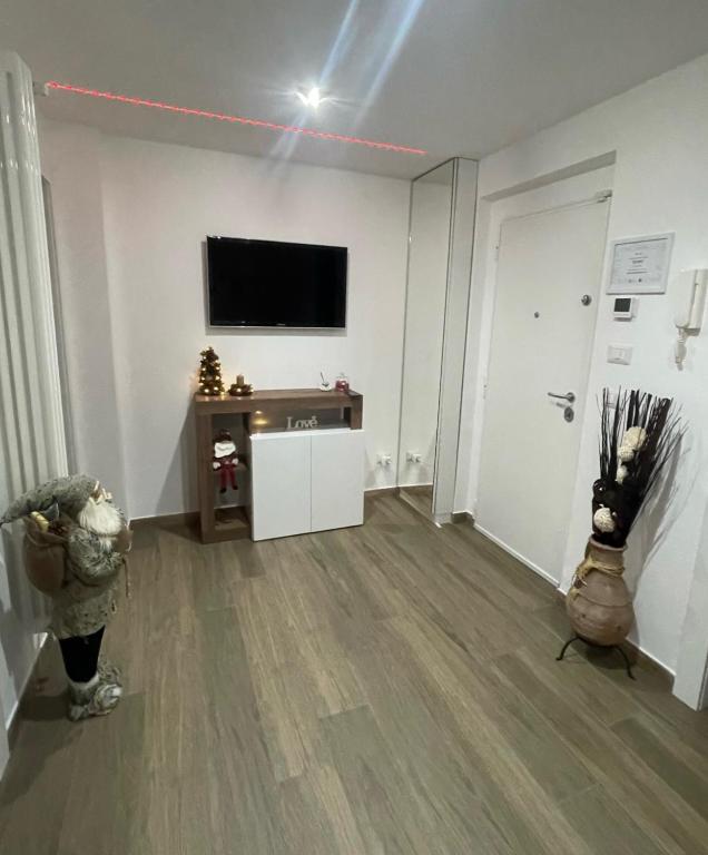 Televízia a/alebo spoločenská miestnosť v ubytovaní Due Cuori Suite