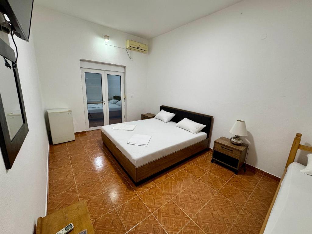 Postel nebo postele na pokoji v ubytování Magda apartments