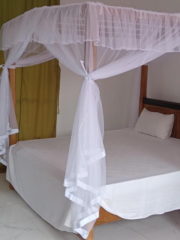 Postel nebo postele na pokoji v ubytování Mallika Resort