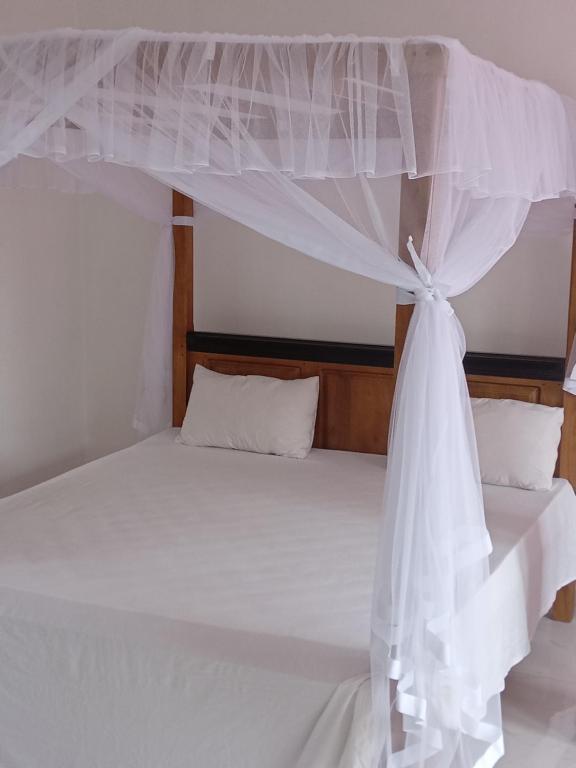 Postel nebo postele na pokoji v ubytování Mallika Resort