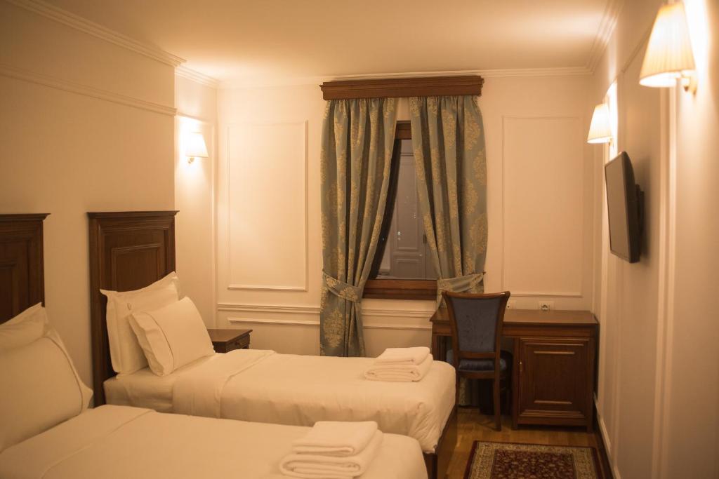 Postel nebo postele na pokoji v ubytování Hotel Opera