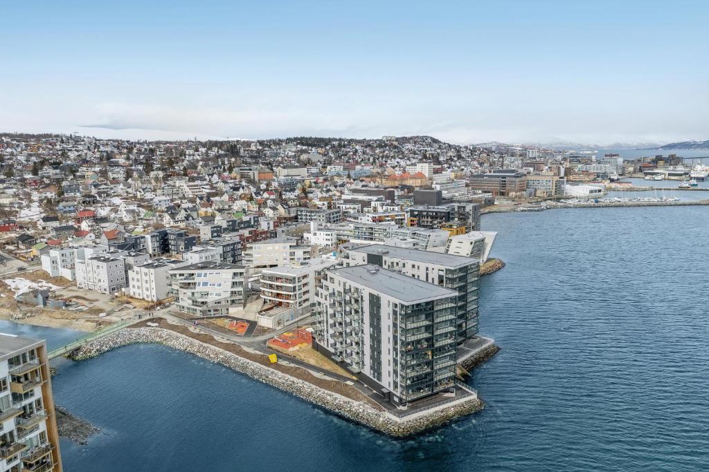 an aerial view of a city next to the water at Seaside apartment in Tromsø