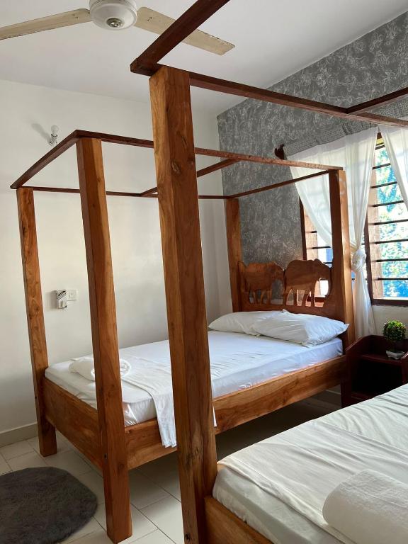 Postel nebo postele na pokoji v ubytování Honeydream Villa