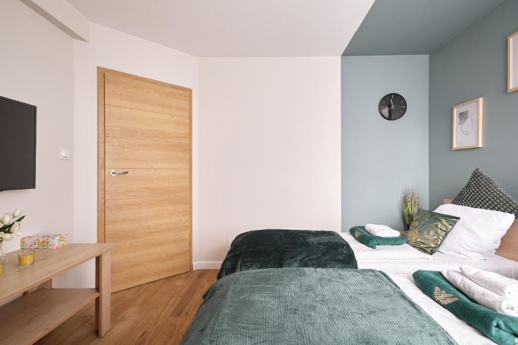 Posteľ alebo postele v izbe v ubytovaní Apartament Karkonoskie Tarasy