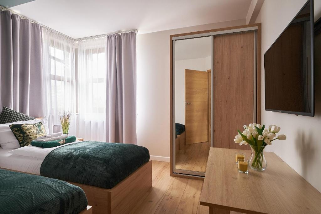Posteľ alebo postele v izbe v ubytovaní Apartament Karkonoskie Tarasy