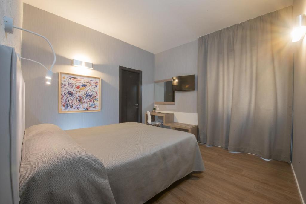 Łóżko lub łóżka w pokoju w obiekcie B&B Fantasie Romane