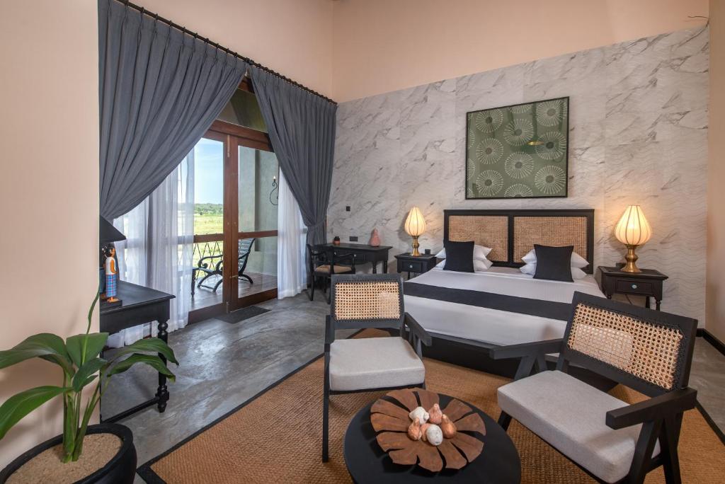 Postel nebo postele na pokoji v ubytování Ceylon Breeze Sigiriya