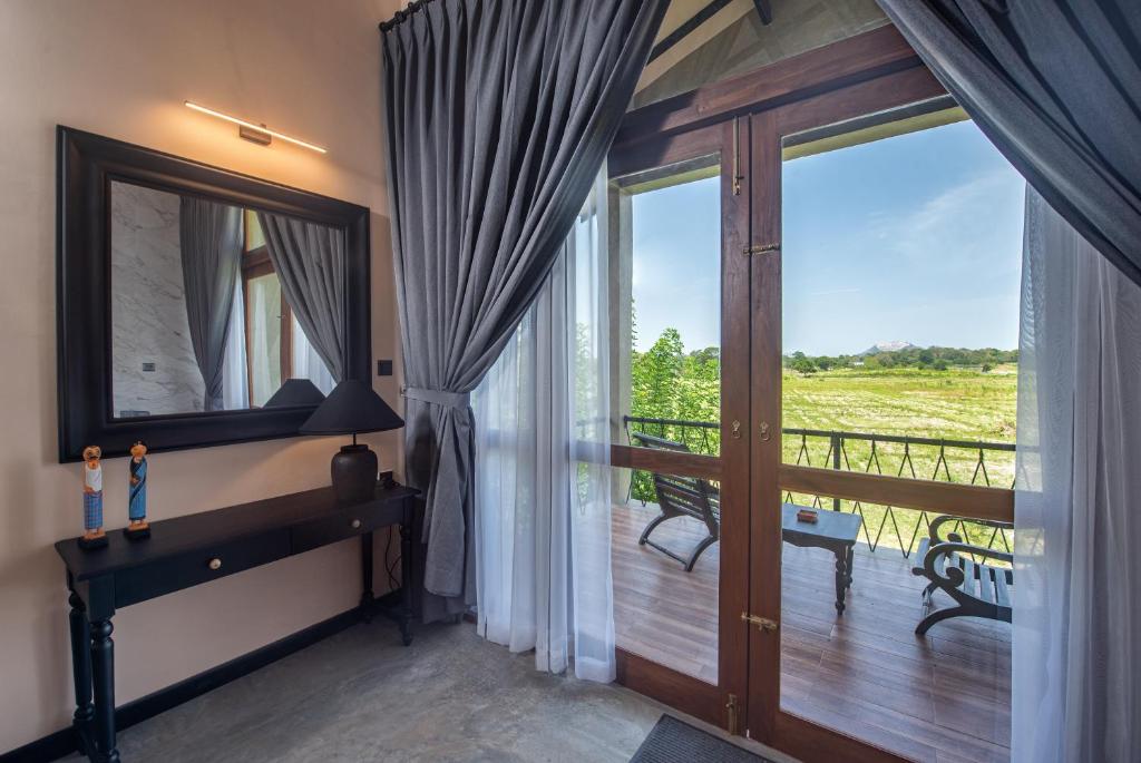Postel nebo postele na pokoji v ubytování Ceylon Breeze Sigiriya