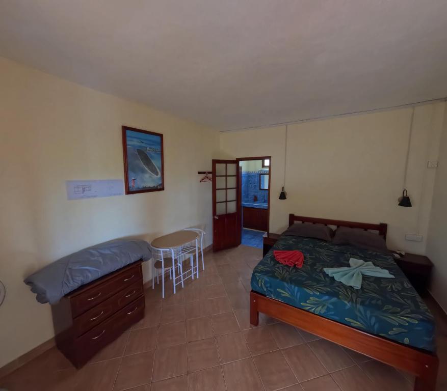 Postel nebo postele na pokoji v ubytování Le Tropical Chez Jeannette