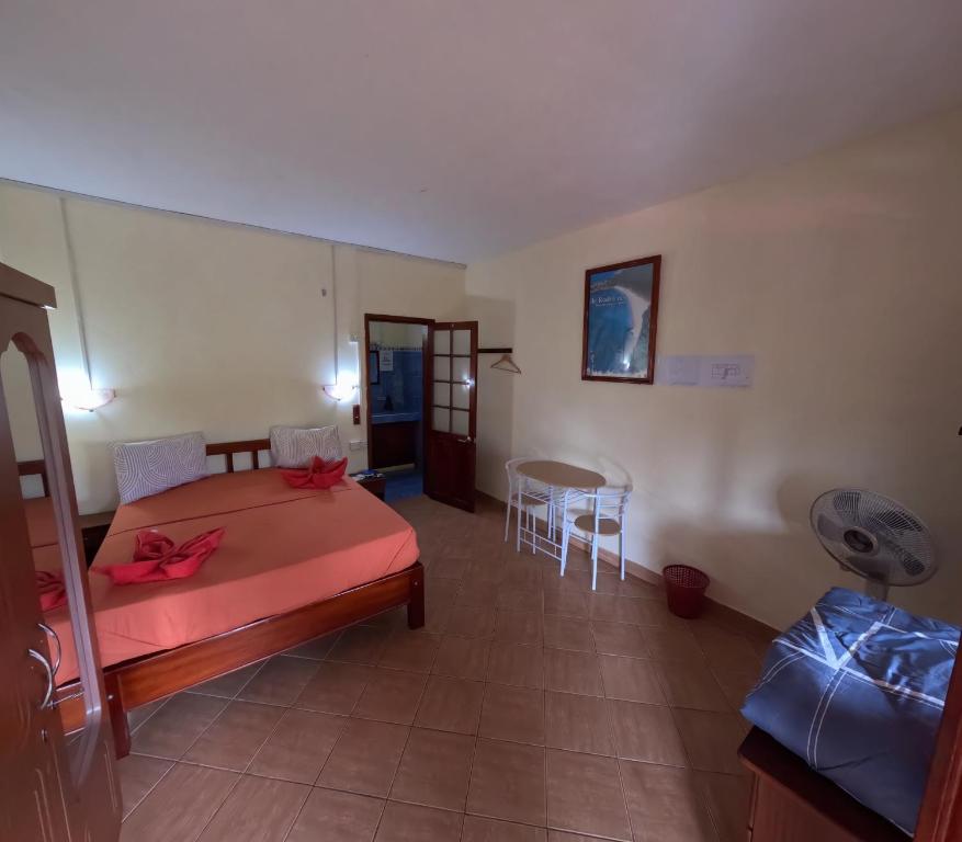 Postel nebo postele na pokoji v ubytování Le Tropical Chez Jeannette
