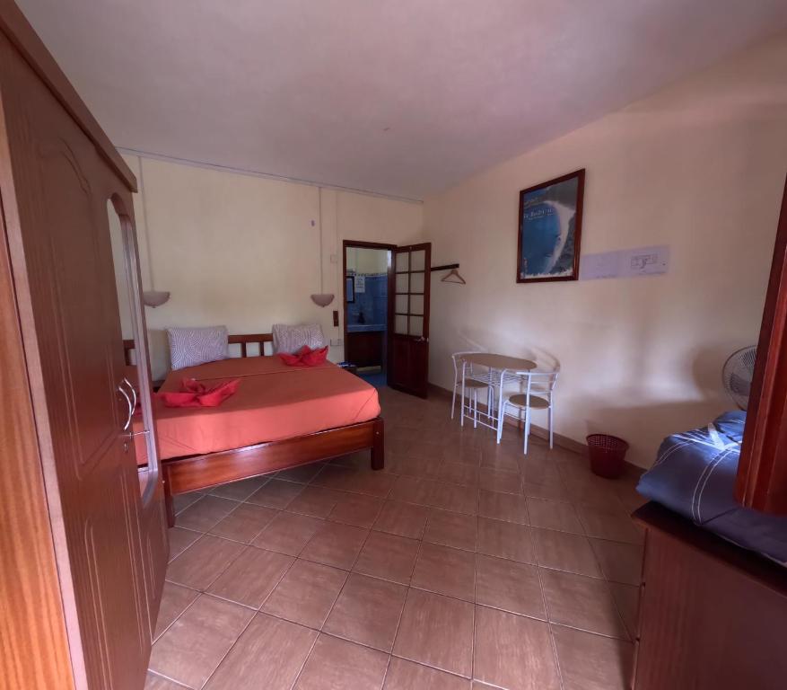 Postel nebo postele na pokoji v ubytování Le Tropical Chez Jeannette