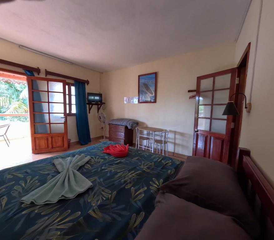 Postel nebo postele na pokoji v ubytování Le Tropical Chez Jeannette