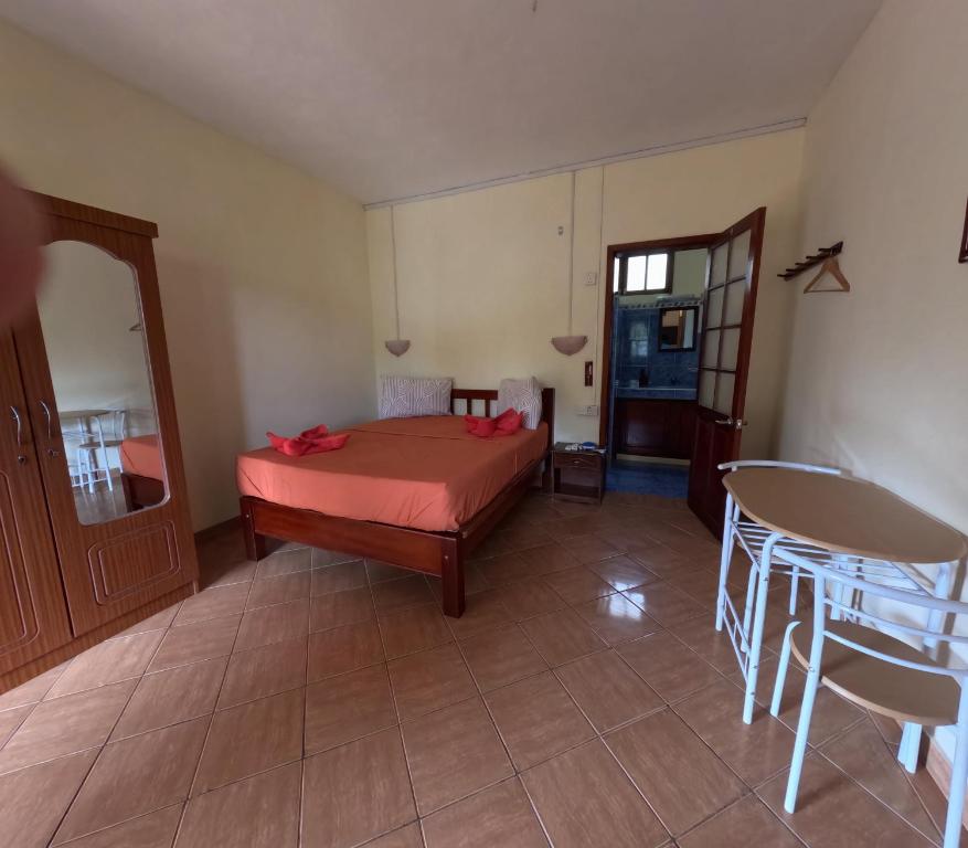 Postel nebo postele na pokoji v ubytování Le Tropical Chez Jeannette