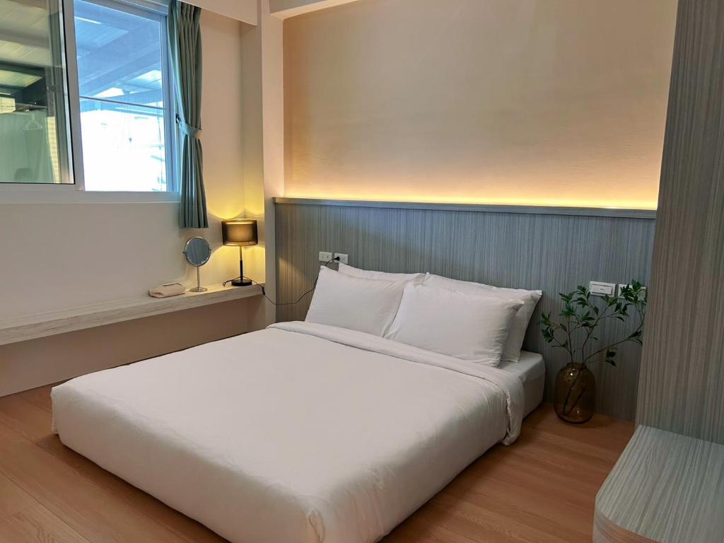 Postel nebo postele na pokoji v ubytování Orange Homestay