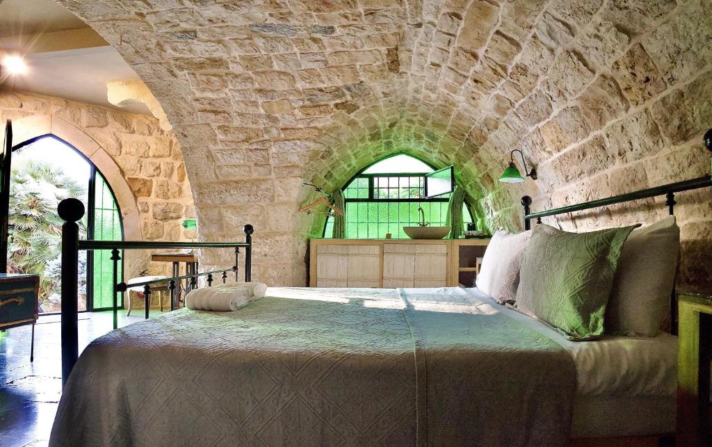 Postel nebo postele na pokoji v ubytování Stone Cellars