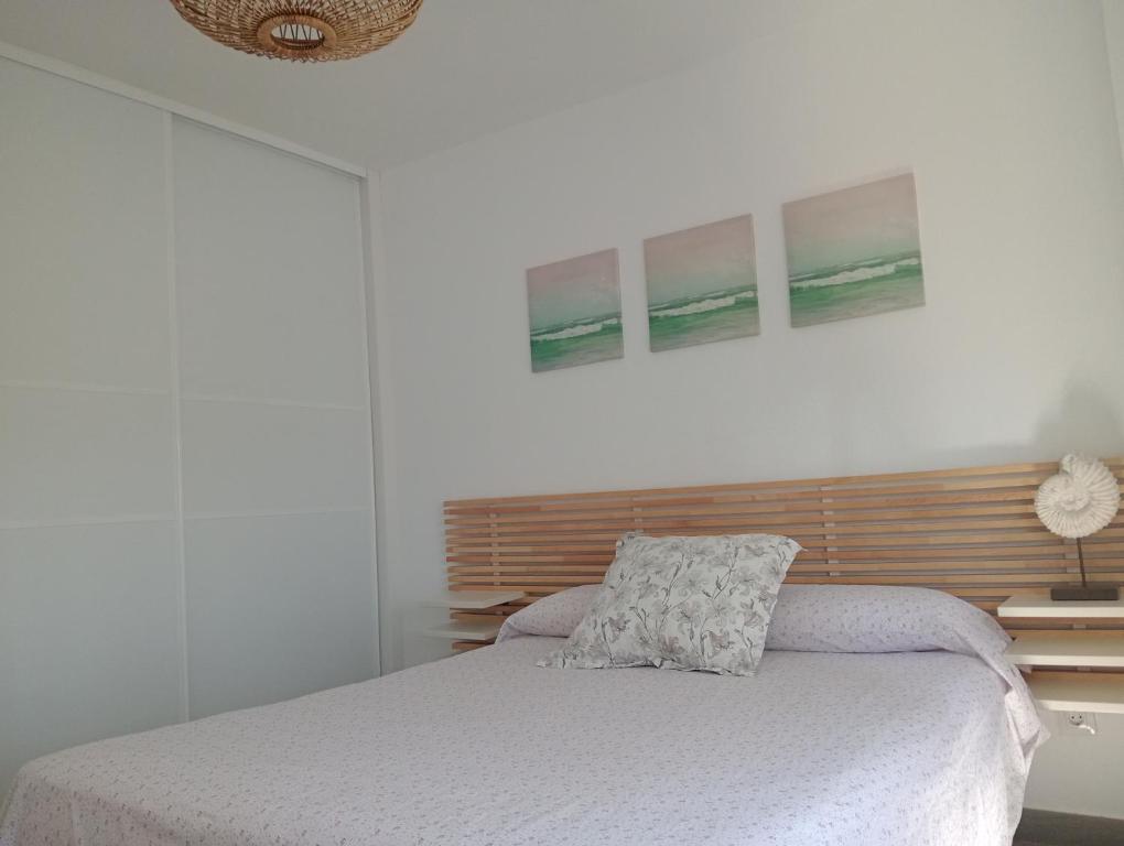 Postel nebo postele na pokoji v ubytování Apartamentos Vacacionales Atlanterra