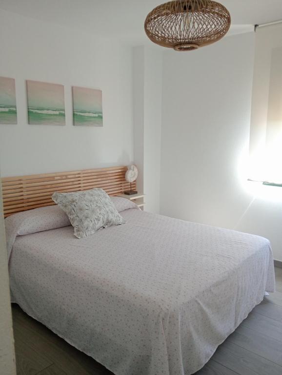 Postel nebo postele na pokoji v ubytování Apartamentos Vacacionales Atlanterra