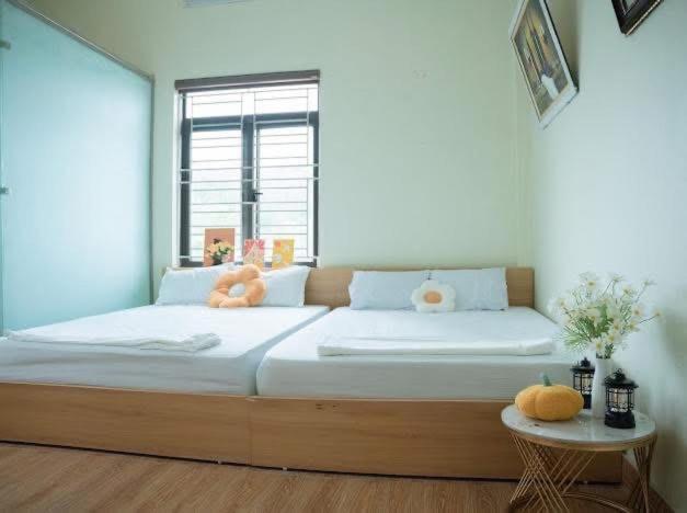Postel nebo postele na pokoji v ubytování nhà nghỉ Ngân Hà
