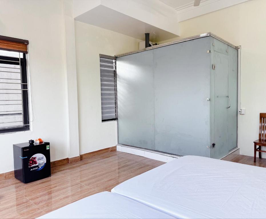 Postel nebo postele na pokoji v ubytování nhà nghỉ Ngân Hà