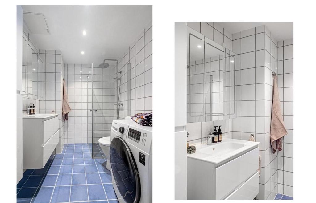 a bathroom with a washing machine and a sink at Cozy apartment in centrum in Oslo
