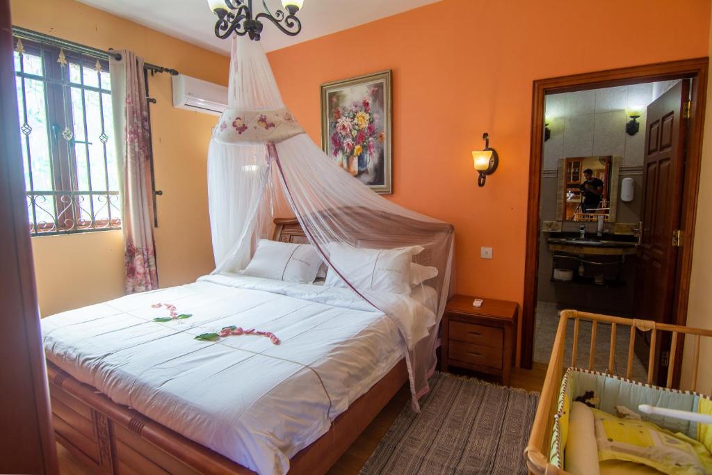 Postel nebo postele na pokoji v ubytování Blue Pearl Resort