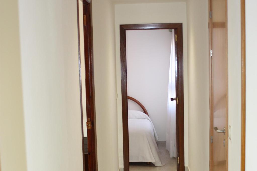 Postel nebo postele na pokoji v ubytování Apartamento Avenida