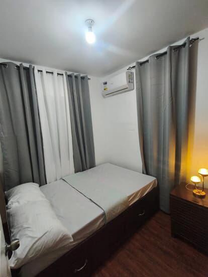 a small bedroom with a bed and a window at Not Avail in Dao