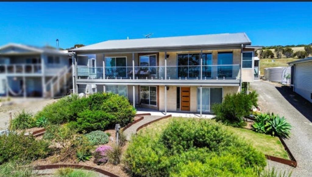 a large white house with a lot of windows at Emu Bay Bliss 'sweeping ocean views' in Emu Bay