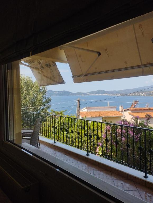 a view from a window of a balcony at Palio Luxury Apartment in Paleo Tsifliki