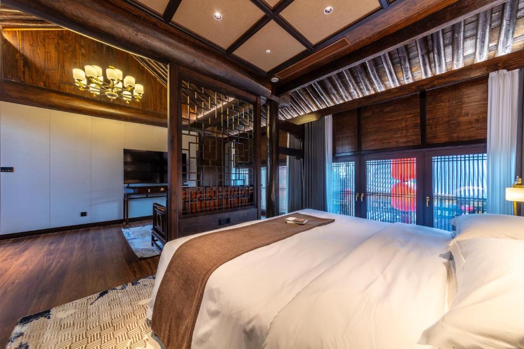 Postel nebo postele na pokoji v ubytování Tao Hotel