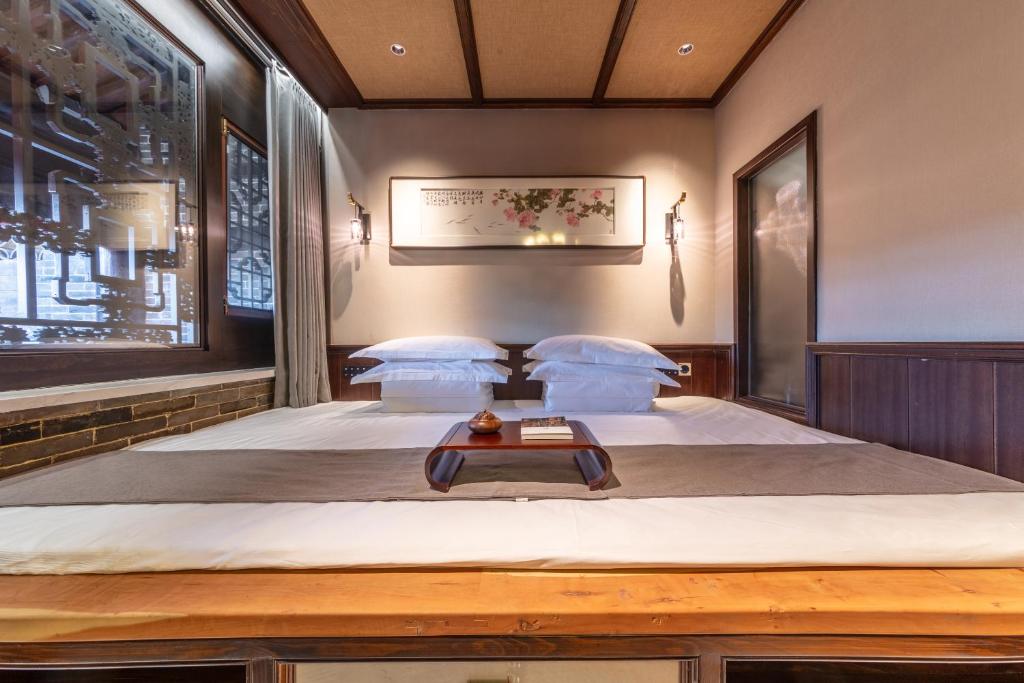 Postel nebo postele na pokoji v ubytování Tao Hotel
