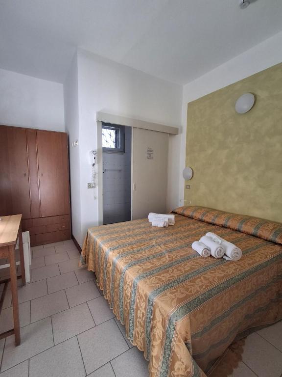 Postel nebo postele na pokoji v ubytování Hotel Pironi