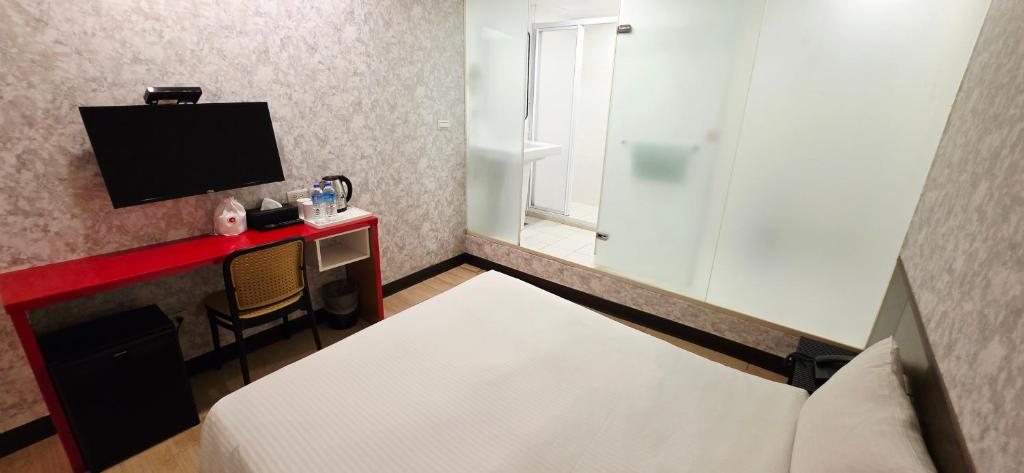 TV a/nebo společenská místnost v ubytování 喜園旅館Ximen Garden Inn