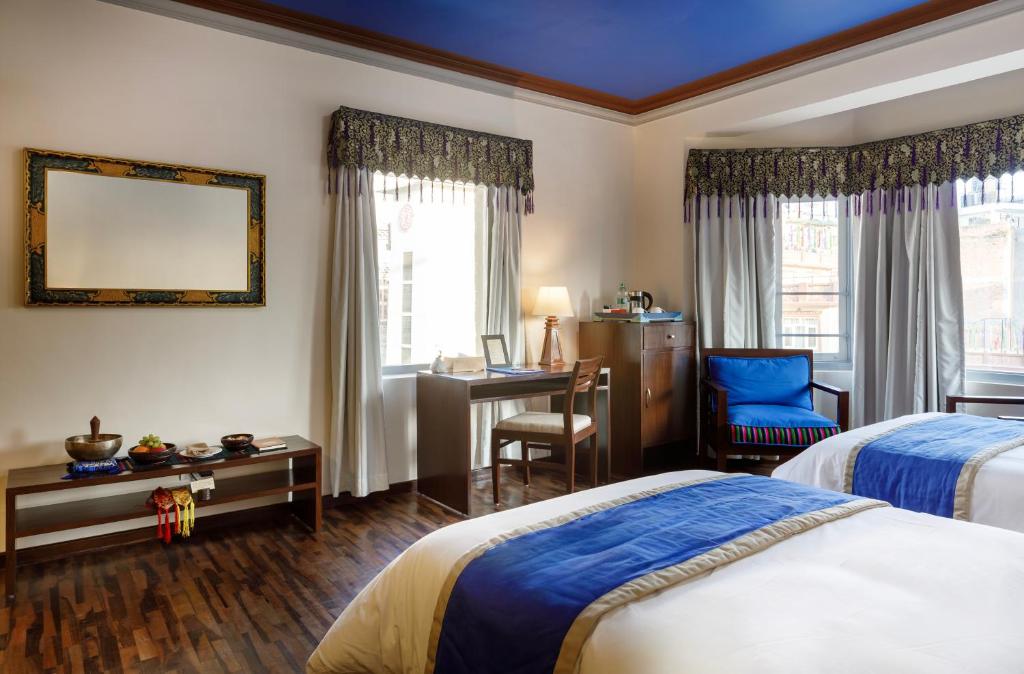 Postel nebo postele na pokoji v ubytování Shambaling Boutique Hotel