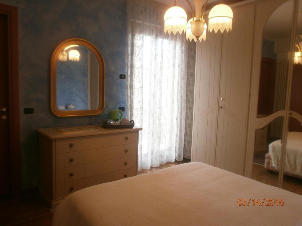Letto o letti in una camera di B&B Dosso Quarel