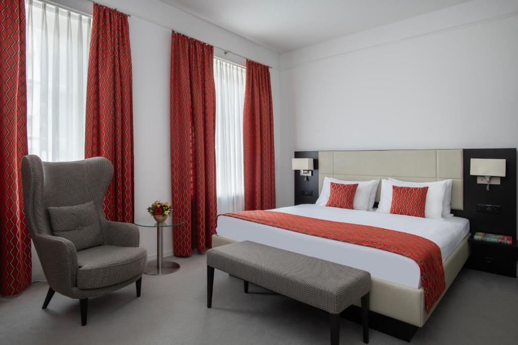 Postel nebo postele na pokoji v ubytování Grand Hotel Europe